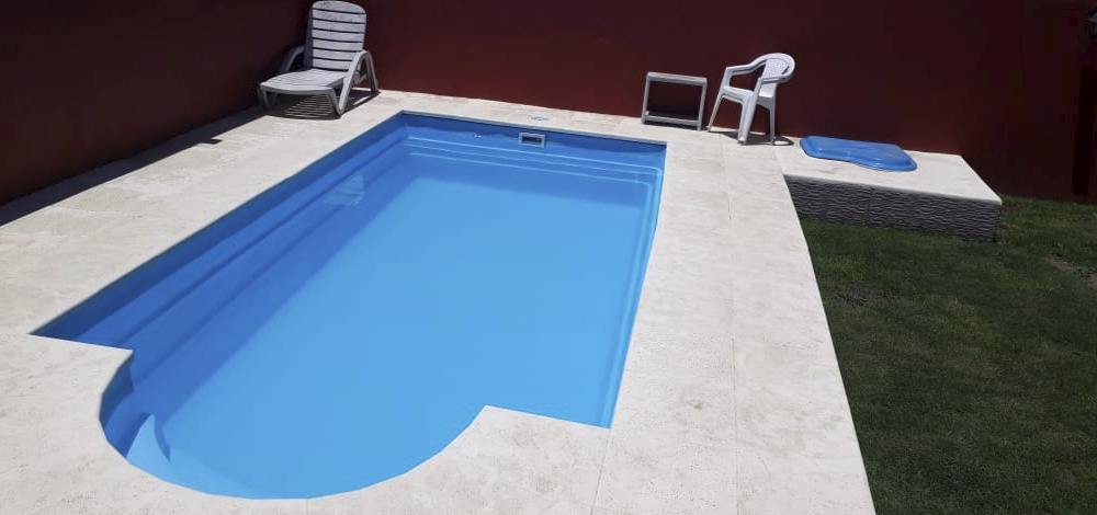 Two funny girls playing in swimming pool. Vacation and travel concept